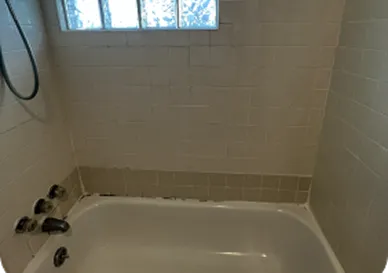 Bathroom tiles before reglazing with dull and stained surface