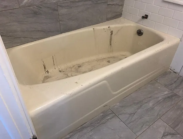 Before comparison of sink reglazing showing flawless transformation