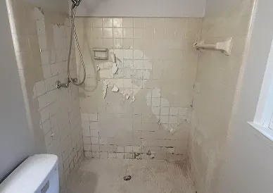 Bathroom tiles before reglazing with dull and stained surface